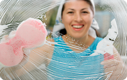 Women Cleaning Glass Window